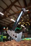 hatchet with wasp hive with teal backdrop