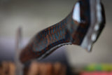 hatchet with wasp hive with teal backdrop